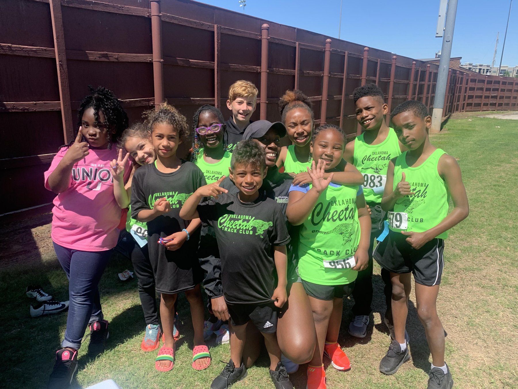 Oklahoma Cheetah athletes gathered together at a track meet