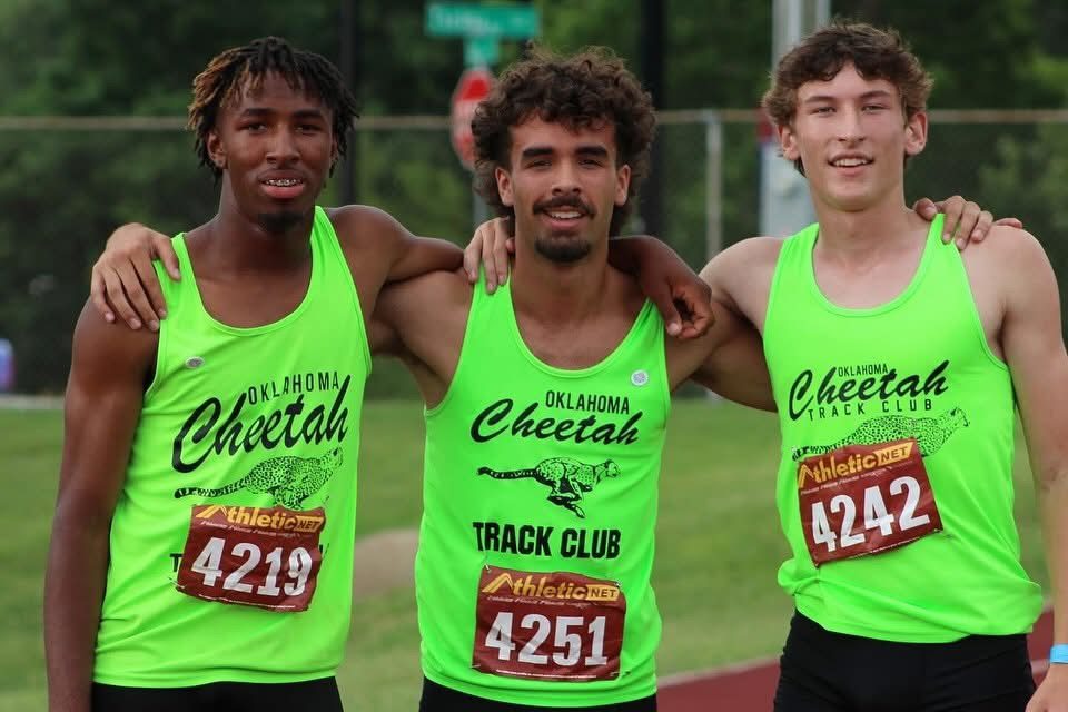 Three Oklahoma Cheetah athletes together after a race
